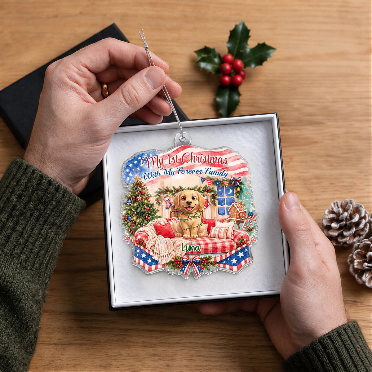 Hands holding the acrylic ornament with a golden retriever named Luna in a gift box
