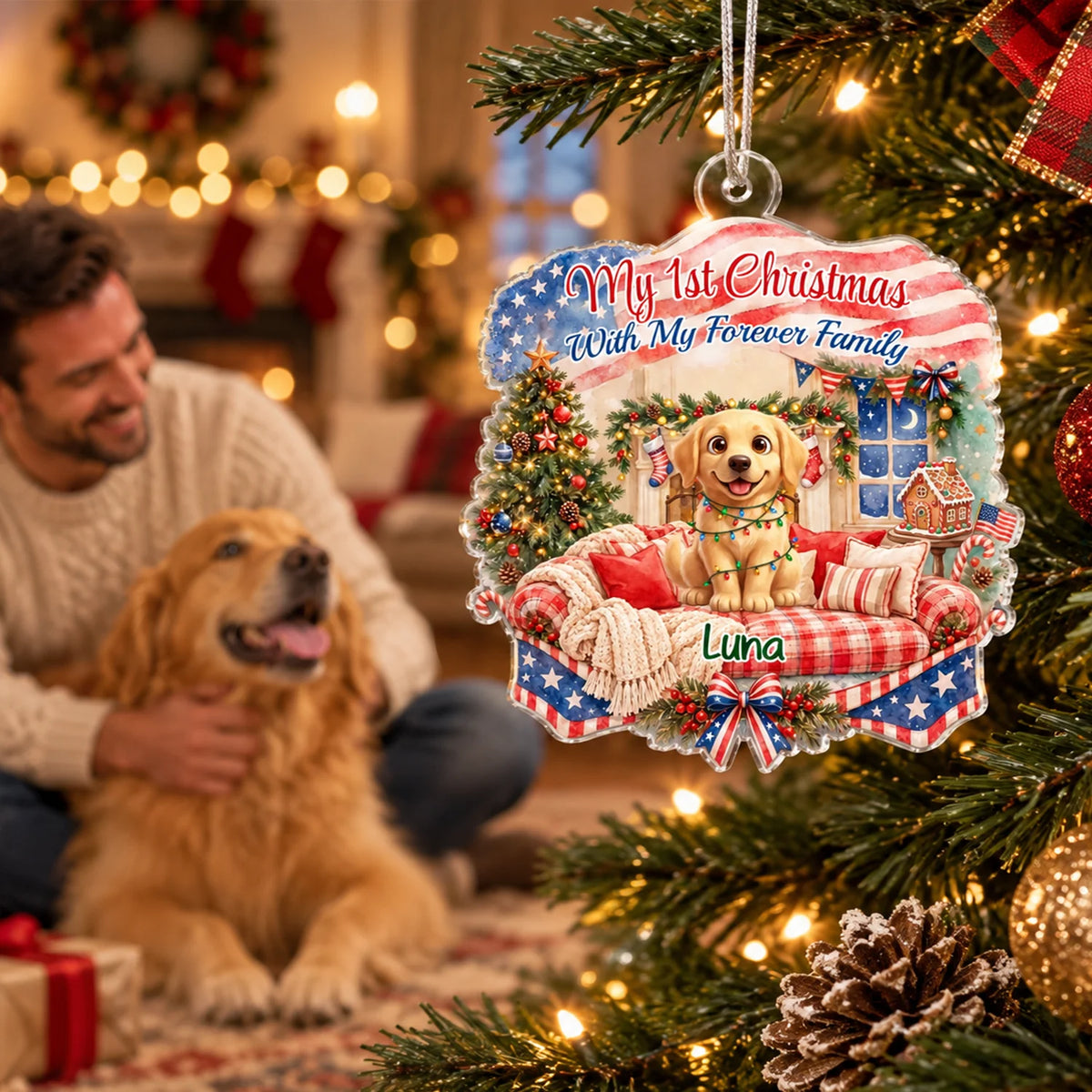 Man with his golden retriever next to the ornament with the name Luna on the Christmas tree