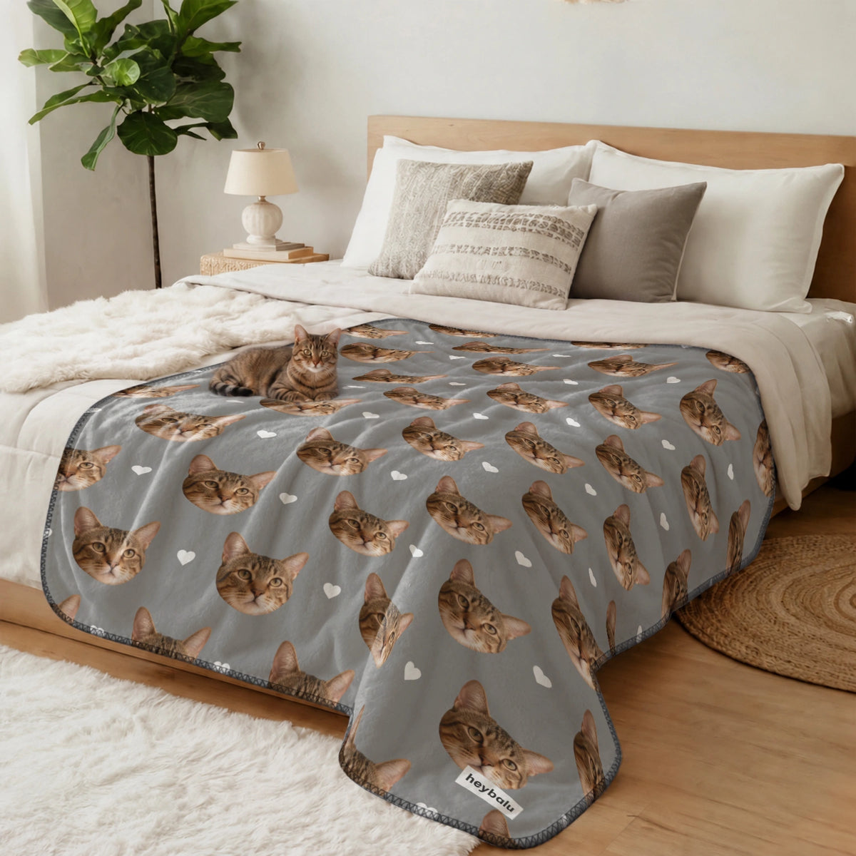 Tabby cat lying on the bed on the gray Cat Photo blanket