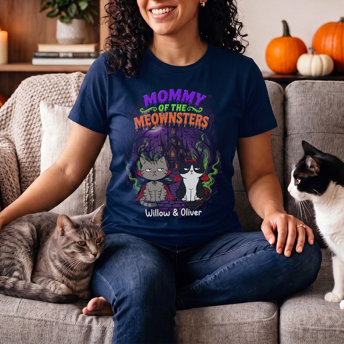 Woman on the couch with cats in the navy Meownsters T-shirt with names