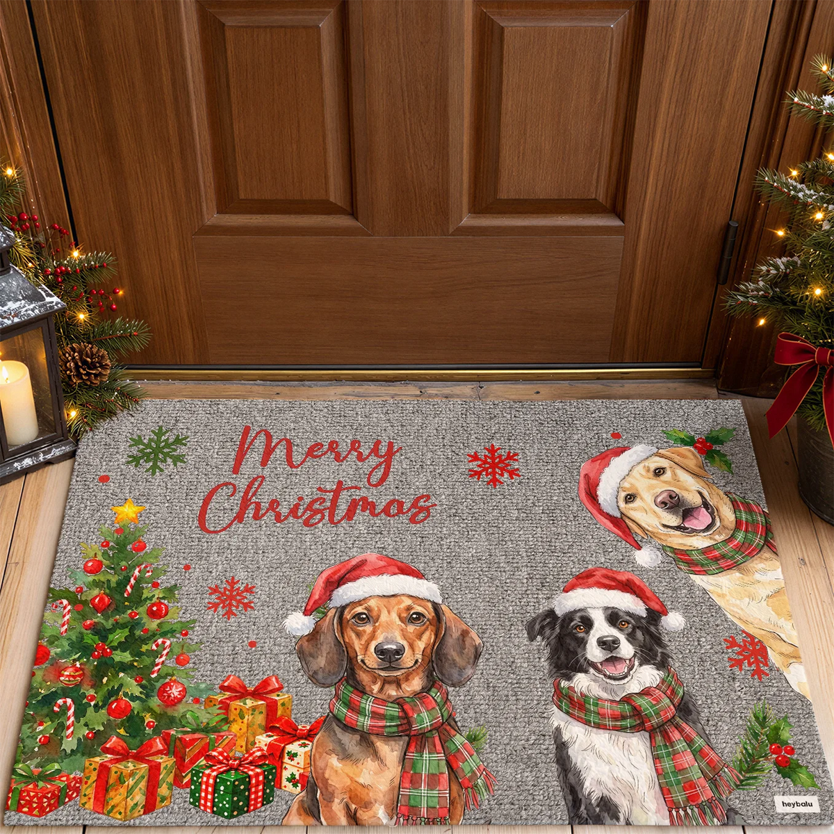 Gray Christmas doormat with three dog illustrations in Santa hats and plaid scarves in front of the door