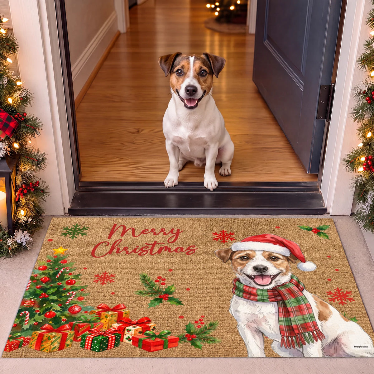 Jack Russell sitting in the doorway behind the Christmas doormat with its illustration