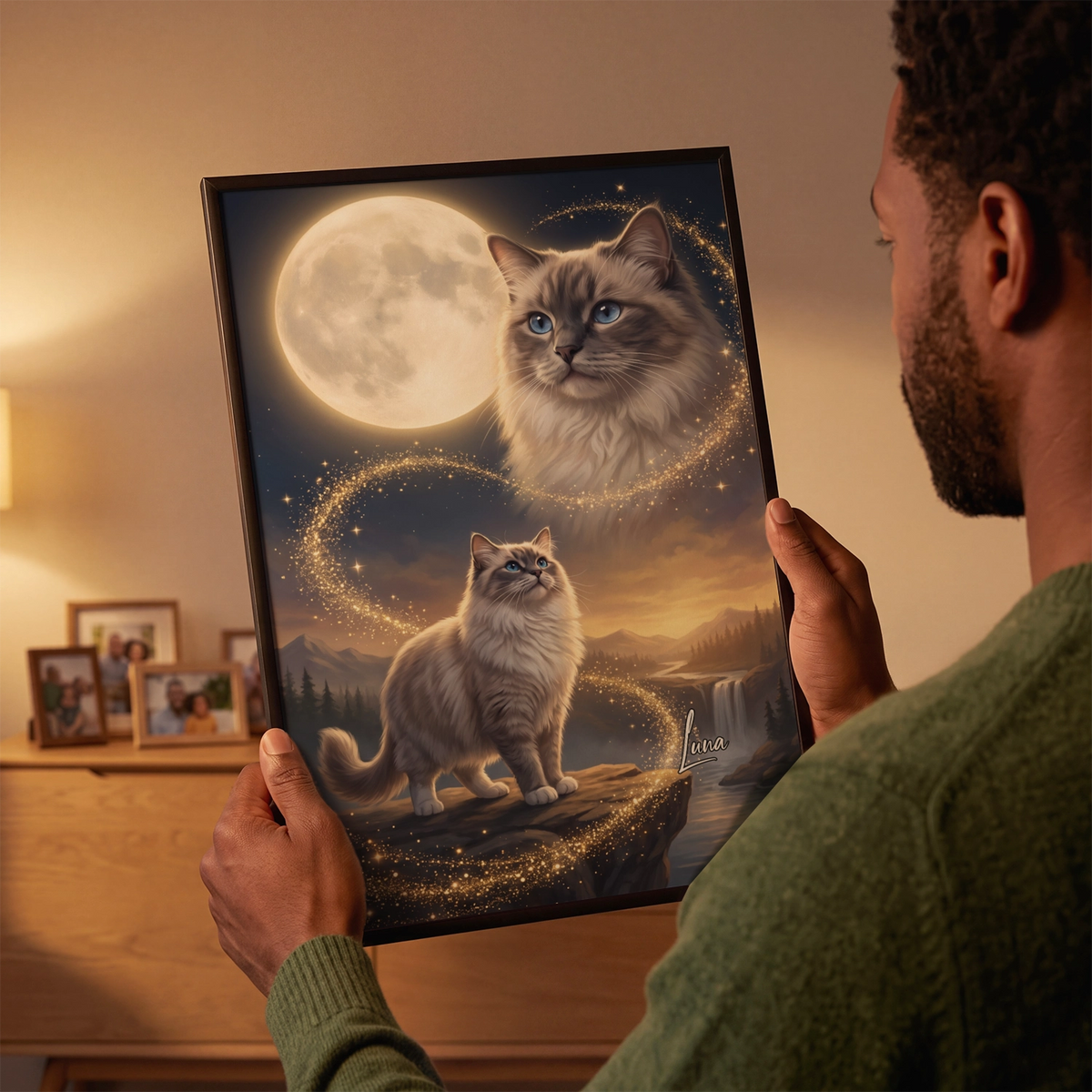 Man looks at the framed Howling Cat poster with a ragdoll cat and moonlit landscape